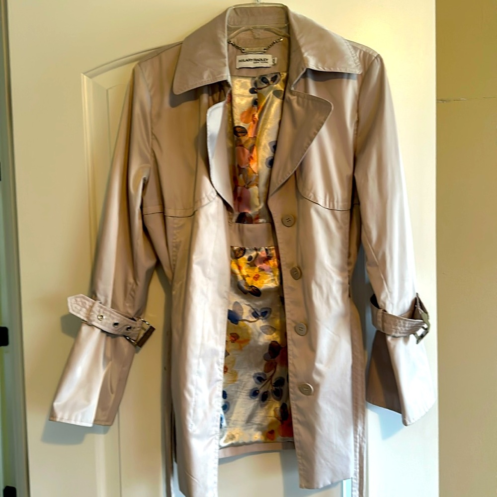 Hip length beige rain jacket